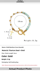 Detail view of gold cross pendant on shell bamboo bead bracelet with OT buckle closure