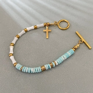 Bamboo style shell bead bracelet with gold cross pendant and OT buckle toggle