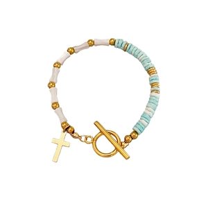 Bamboo style shell bead bracelet with gold cross pendant and toggle clasp for women