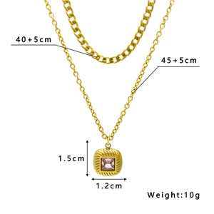 Double-layered gold chain necklace with pink zircon square pendant and cuban link details
