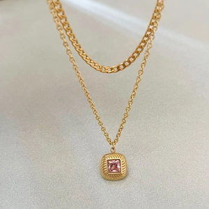 Golden double layer necklace featuring pink square zircon pendant and cuban chain design