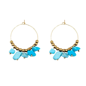 Bohemian gold hoop earrings featuring turquoise stones and polished metallic beads