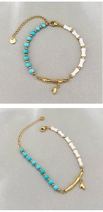 Detail of stainless steel clasp and leaf pendant on turquoise beaded bamboo bracelet
