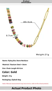 Detail of colorful stone beaded necklace with gold titanium steel chain links
