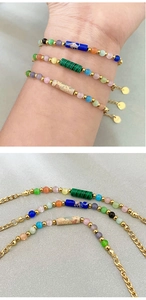 Detailed macro view of a 3-piece layered bracelet with colorful stones and gold hardware