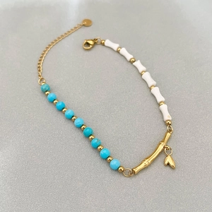 Vintage asymmetric bracelet with turquoise beads, shell bamboo tubes and heart charm