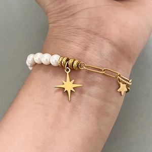 18K gold plated stainless steel pearl bracelet featuring a toggle clasp and star charms