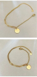 Detail of gold-plated stainless steel bracelet with floral charm and paperclip link design