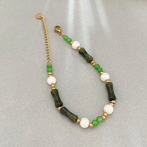 Bamboo shaped cat eye stone beaded bracelet with green beads and gold hardware