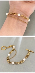 Detailed view of double-layer gold OT bracelet with Cuban chain and five white pearls