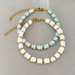 Elegant beaded shell bracelets in light blue and white with gold lobster clasp and extension chain