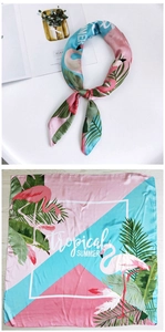 Detail of 70cm square scarf featuring pink flamingo and green palm leaf tropical patterns