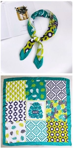 Detail of 70cm silk scarf with tropical leaf pattern and geometric patchwork layout