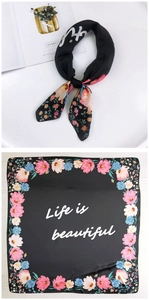 Flat lay and knotted view of black floral silk scarf with Life is beautiful text