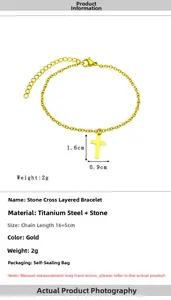 Macro detail of cross pendant bracelet showing size 1.6x0.9cm and 16+5cm chain specs