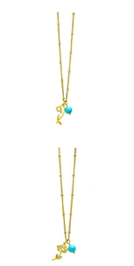 Detailed close-up of golden tulip and lotus pendant necklaces with turquoise birthstones