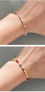 Detailed macro view of 3mm colorful crystal bead bracelets with faceted glass texture