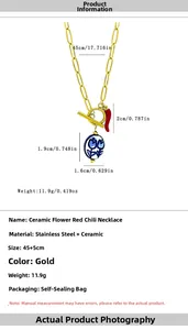 Detail of chili and ceramic flower charms on a 45+5cm gold stainless steel necklace