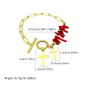 Gold paperclip chain bracelet with irregular coral beads and twin cross charms OT clasp