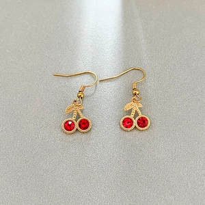 Elegant gold-tone cherry drop earrings with sparkling red rhinestone crystals
