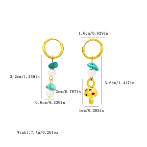 Mixed color mushroom hoop earrings with turquoise and pearl charms on white background