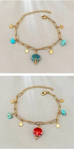 Detailed macro view of starfish charms, ceramic beads, and stones on gold-plated bracelets