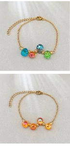 Detail of 18k gold plated stainless steel bracelets with colorful crystal teardrop beads