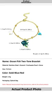 Detail view of 18K gold plated marine fish bracelet with pearl and blue stone charms