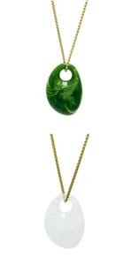 Detail of irregular acrylic pebble pendants in dark green marble and milky white finish