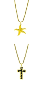 Detail of gold box chains with starfish and black enamel cross charms in vintage style