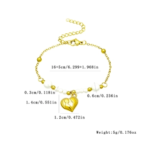 Golden stainless steel beaded bracelet with pearls and heart silhouette pendant