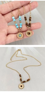 Detailed close-up of bohemian sun pendants with turquoise and tiger eye stones in gold