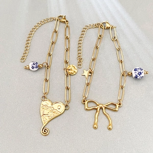 18k gold plated heart and bow bracelet with blue white porcelain beads for women