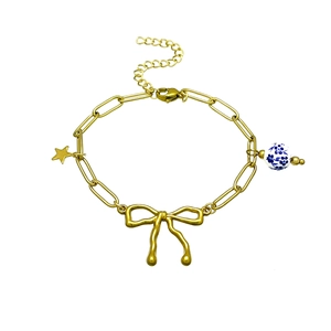 18k gold plated stainless steel bracelet with bow, star charm and floral ceramic bead