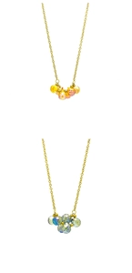 Detailed macro view of faceted crystal water drop pendants on gold stainless steel chains