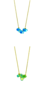 Detail of gold chain necklaces with blue and green multifaceted crystal bead pendants