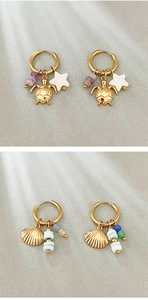Detailed view of marine-themed gold earrings with sea turtle and scallop shell charms