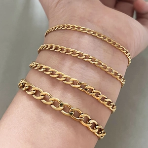 Set of four gold stainless steel Cuban curb chain bracelets in various widths for men and women