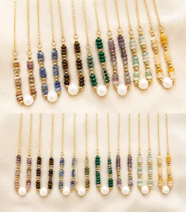 Detail of natural stone necklace with freshwater pearl and 18k gold plated chain