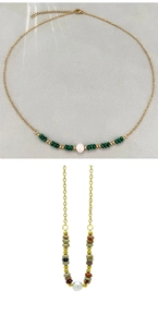 Detail of 18k gold plated stainless steel necklaces with natural stones and pearls