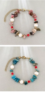 Detail of handmade beaded bracelets with natural stones, pearls and gold lobster clasp