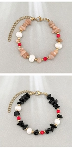 Detailed macro view of natural stone and freshwater pearl beaded bracelet with gold clasp