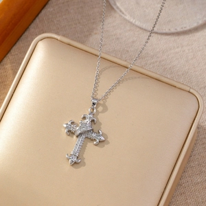 Hip hop silver cross pendant necklace with micro-set zircons on a jewelry box