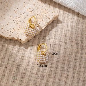 Chic heart-shaped pearl bag drop earrings with gold hooks for women in warm beige setting