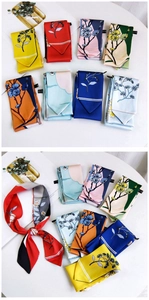 Detailed close-up of colorful floral skinny scarves in eight elegant color options