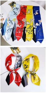 Detail of silk twilly scarf with Chinese floral patterns and contrasting edge stripes