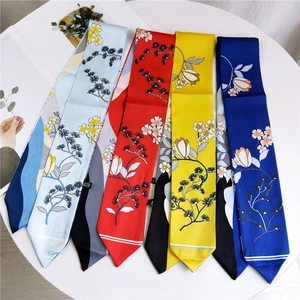 Satin floral twilly scarf set in light blue, red, yellow, and blue with botanical patterns