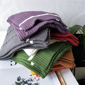Thick ribbed knit scarves in multiple colors featuring striped texture for winter warmth
