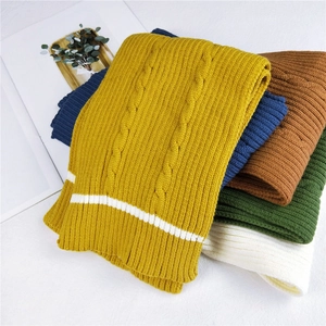 Thick knitted striped scarf in assorted colors featuring cable knit texture and ribbing