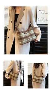 Detail of plaid wool shoulder bag with vintage metal chain and leather trim accents